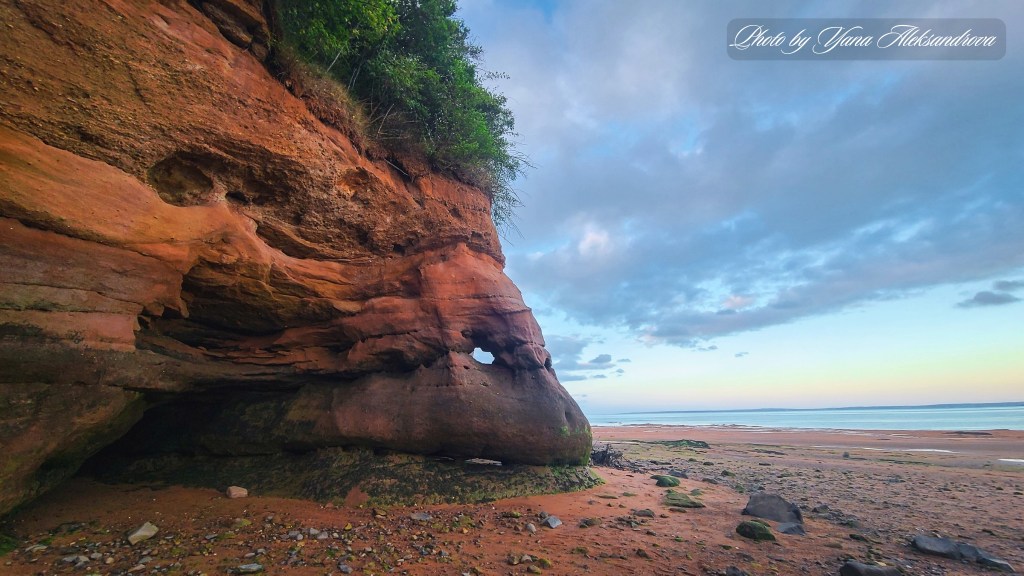 Kingsport Beach at low tide, Nova Scotia, Canada. Red cliffs and unique shapes photo